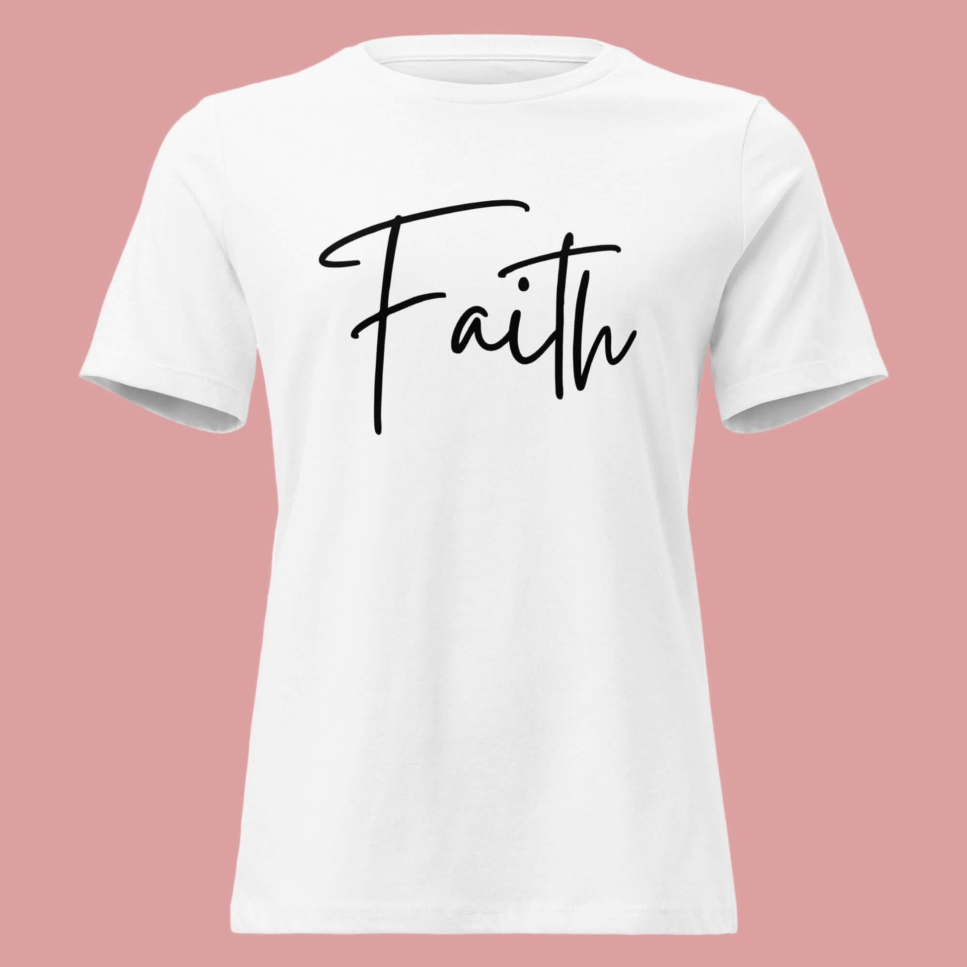 Faith tee in white featuring elegant black cursive lettering of the word 'Faith' on a pink background.