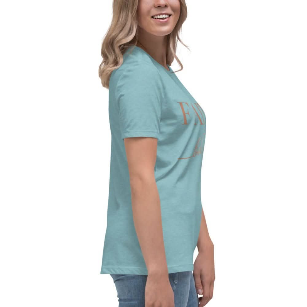Woman wearing the Faith Looks Good on You Tee in Blue Lagoon color, showcasing a stylish and inspirational design.