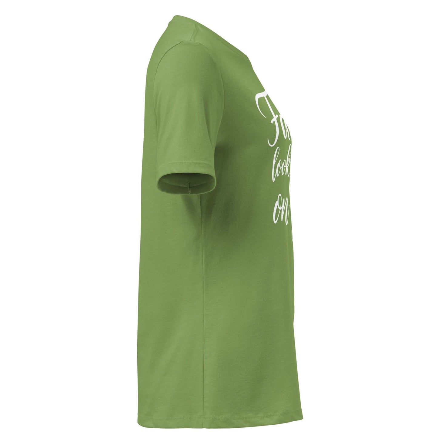 Side view of Faith Looks Good on You Tee in green featuring white cursive text, showcasing a stylish, casual look.